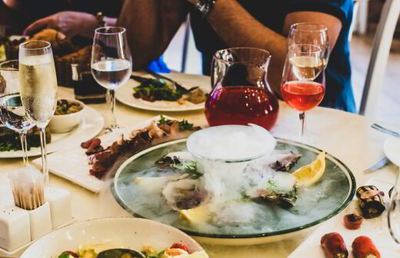 Table set with seafood, wine and champagne at a waterside restaurant