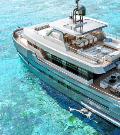 Aerial view of a large motor yacht in turquoise water